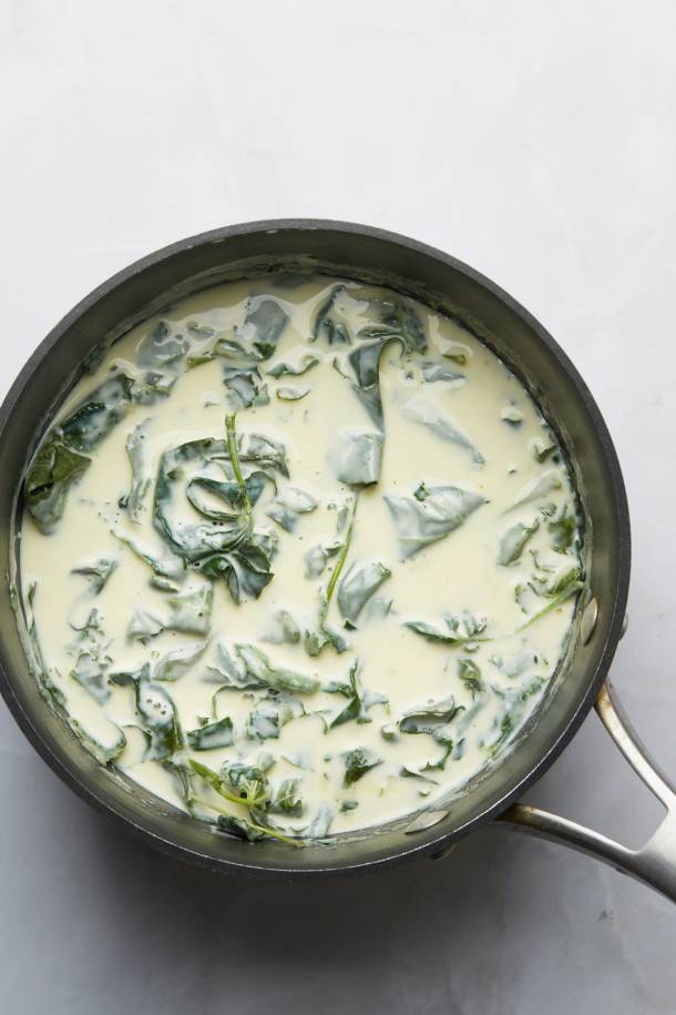 Toasted fig leaves steeping in a saucepan of dairy